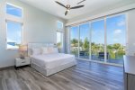 2nd level master bedroom with King size bed and water views from the private balcony